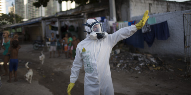 A municipal worker gestures during an operation to combat the Aedes aegypti mosquitoes that transmits the Zika virus in Recife, Pernambuco state, Brazil, Tuesday, Jan. 26, 2016. Brazil's health minister Marcelo Castro says the country is sending some 220,000 troops to battle the mosquito blamed for spreading a virus suspected of causing birth defects, but he also says the war is already being lost. (AP Photo/Felipe Dana)