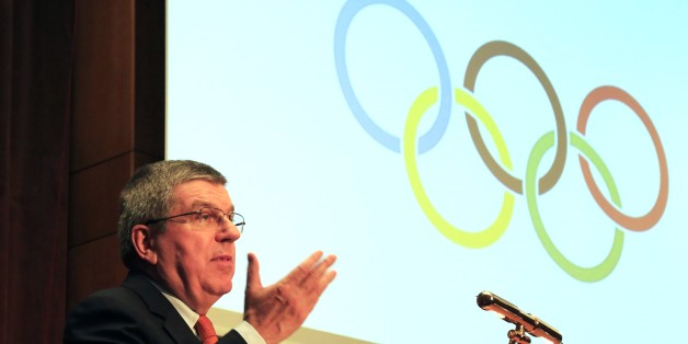 IOC President Thomas Bach speaks during a sporting awards ceremony of Greek athletes in Athens on Wednesday, Jan. 27, 2016. Bach says he is confident the Rio Olympics will âoverwhelmâ the world, despite the host countryâs major financial crisis. (AP Photo/Paris Sarrikostas)