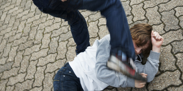 Two boys arguing in the schoolyard