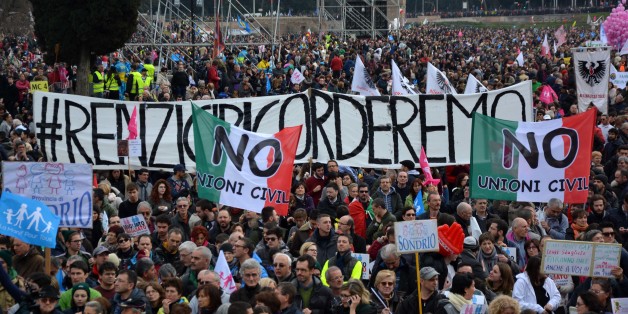ROME, ITALY - JANUARY 30: Italians hold banners as they protest against the law proposal, by Democratic Party Senator Monica Cirinna, to give gay civil partnerships legal status during the 'Family Day' rally, in Rome, Italy on January 30, 2016. (Photo by Baris Seckin/Anadolu Agency/Getty Images)