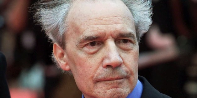 FILE - This Wednesday, May 16, 2001 file picture shows French director Jacques Rivette arriving for the screening of his film "Who Knows", in competition at the Film Festival in Cannes, France. French director Jacques Rivette, a secretive pioneer of convention-bashing New Wave film who brought renown to women actors such as Emmanuelle Beart, has died at 87. (AP Photo/Michel Euler, File)