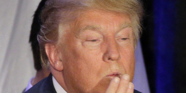 Republican presidential candidate, businessman Donald Trump blows a kiss after speaking at his caucus night rally, Monday, Feb. 1, 2016, in West Des Moines, Iowa. (AP Photo/Jae C. Hong)