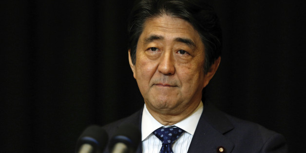 Japanese Prime Minister Shinzo Abe pauses during a press conference in Kuala Lumpur, Malaysia, Sunday, Nov. 22, 2015. (AP Photo/Lai Seng Sin)
