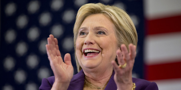 Democratic presidential candidate Hillary Clinton applauds former Arizona Rep. Gabby Giffords as she speaks at a Clinton event in Hampton, N.H., Tuesday Feb. 2, 2016, on Clinton's first day in New Hampshire after winning the Iowa Caucus. (AP Photo/Jacquelyn Martin)