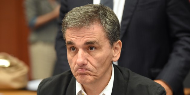 Greece's Finance Minister Euclid Tsakalotos attends an Eurogroup meeting at the EU headquarters in Brussels, on August 14, 2015. Eurozone finance ministers were scheduled to go over a new bailout programme in return for reforms by Greece, but some of the creditors feel Athens' pledges are not precise enough. AFP PHOTO / EMMANUEL DUNAND (Photo credit should read EMMANUEL DUNAND/AFP/Getty Images)