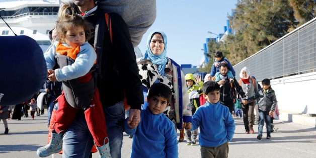 ATHENS, GREECE - FEBRUARY 01: Refugees, mostly including Syrians disembark from a sheep as they arrived to port of Piraeus by the passenger ships in Athens, Greece on February 01, 2016. (Photo by Ayhan Mehmet/Anadolu Agency/Getty Images)
