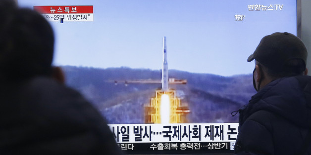 South Koreans watch a TV news program with a file footage about North Korea's rocket launch plans, at Seoul Railway Station in Seoul, South Korea, Wednesday, Feb. 3, 2016. South Korea warned on Wednesday of "searing" consequences if North Korea doesn't abandon plans to launch a long-range rocket that critics call a banned test of ballistic missile technology. The headline on the screen reads "North Korea plans to launch a missile." (AP Photo/Ahn Young-joon)