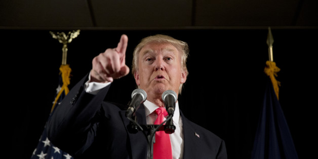 Republican presidential candidate Donald Trump speaks with members of the media during a news conference Tuesday, Feb. 2, 2016, in Milford, N.H. (AP Photo/Matt Rourke)