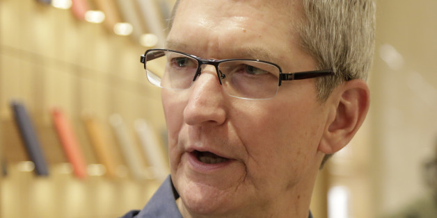 Apple CEO Tim Cook visits the Upper East Side Apple Store, Wednesday, Dec. 9, 2015, in New York. (AP Photo/Mark Lennihan)