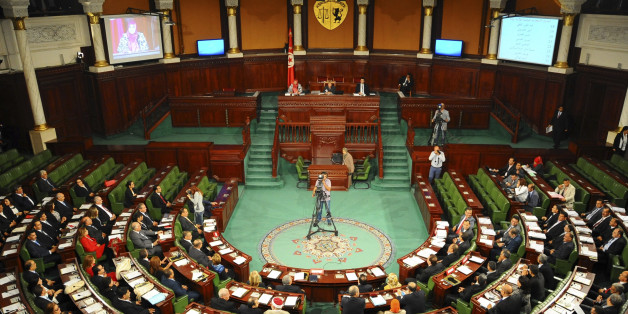 Tunisian parliament members gather during the inaugural session of the newly elected Tunisian parliament in Tunis, Tuesday, Dec. 2, 2014. This is the first national assembly meeting since the October 2014 legislative elections that resulted in a victory for opposition secular parties. (AP Photo/Hassene Dridi)