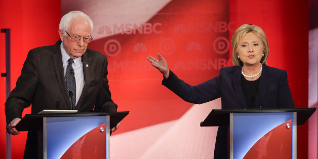 Democratic presidential candidate, Sen. Bernie Sanders, I-Vt, listens as Democratic presidential candidate, Hillary Clinton answers a question during a Democratic presidential primary debate hosted by MSNBC at the University of New Hampshire Thursday, Feb. 4, 2016, in Durham, N.H. (AP Photo/David Goldman)