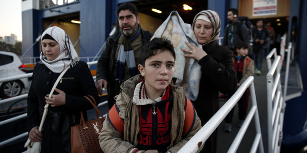 Migrants and refugees disembark from a ferry after their arrival at the port of Piraeus near Athens, Sunday, Jan. 31, 2016. Europe has endured a huge influx of migrants, most of whom undertake a dangerous journey in search of a better life. On Saturday, at least 37 people drowned, including children and babies, when their boat capsized during the short trip from Turkey to Greece. (AP Photo/Yorgos Karahalis)