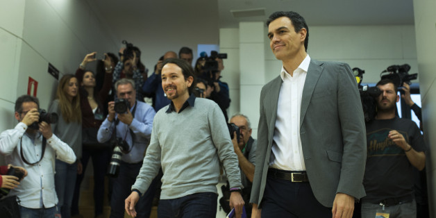 Spain's Socialist Party leader Pedro Sanchez, right, and Podemos Party leader Pablo Iglesias arrive for their meeting at the Spanish parliament in Madrid, Friday, Feb. 5, 2016. The meeting between Sanchez and Iglesias is a part of the negotiation rounds to try to form a government after elections. (AP Photo/Francisco Seco)