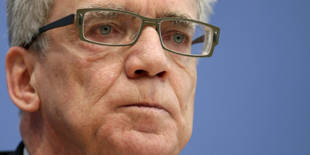 German Interior Minister Thomas de Maiziere attends a press conference to present the 2014 migration report in Berlin, Germany, Wednesday, Jan. 6, 2016. In addition to the report, de Maiziere said that in 2015 nearly 1.1 million people were registered as asylum-seekers in the country , including more than 400,000 persons from Syria. (AP Photo/Michael Sohn)
