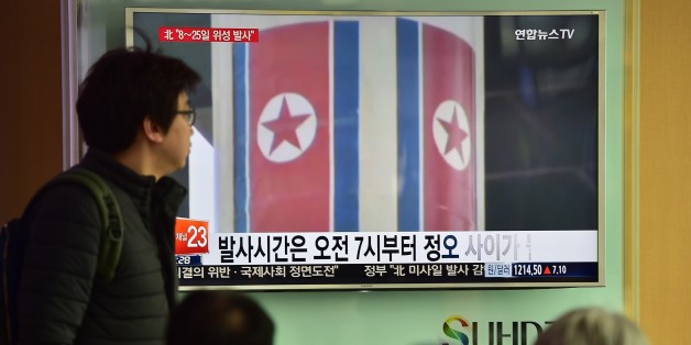 People watch a news report on North Korea's planned rocket launch as the television screen shows file footage of North Korea's Unha-3 rocket which launched in 2012, at a railway station in Seoul on February 3, 2016. North Korea announced it planned to launch a space rocket between February 8-25, a move condemned by the United States as 'another egregious violation' of UN resolutions following Pyongyang's nuclear test last month. AFP PHOTO / JUNG YEON-JE / AFP / JUNG YEON-JE (Photo credit should read JUNG YEON-JE/AFP/Getty Images)