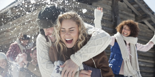 Friends enjoying snowball fight