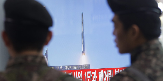 South Korean army soldiers watch a TV news program with a file footage about North Korea's rocket launch at Seoul Railway Station in Seoul, South Korea, Sunday, Feb. 7, 2016. North Korea on Sunday defied international warnings and launched a long-range rocket that the United Nations and others call a cover for a banned test of technology for a missile that could strike the U.S. mainland. (AP Photo/Ahn Young-joon)