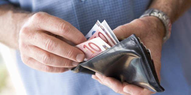 Man counting banknotes in wallet