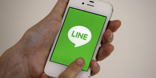 A smart phone is shown with messaging app Line in Seoul, South Korea, Wednesday, July 16, 2014. Naver Corp. said its subsidiary Line Corp. that operates a popular mobile messaging app is considering listing its shares in Tokyo or New York. Naver, South Korea's largest Internet company, said Wednesday that Line could sell shares in an initial public offering in both Japan and the U.S. (AP Photo/Lee Jin-man)