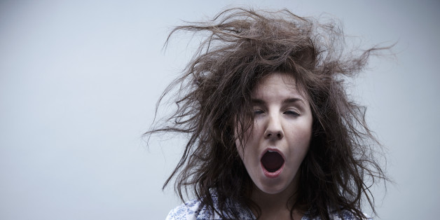 Young woman yawning, close up
