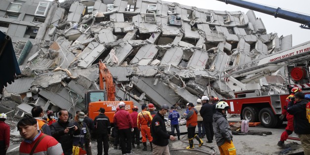 In this Saturday, Feb. 6, 2016 photo, rescue workers search a collapsed building from an early morning earthquake in Tainan, Taiwan. A powerful, shallow earthquake struck southern Taiwan before dawn Saturday. (AP Photo/Wally Santana, File)