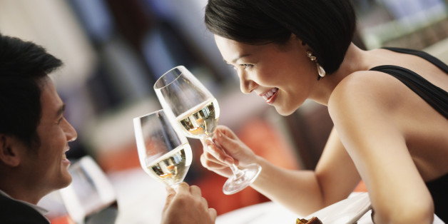 Man and Woman Toasting Glasses