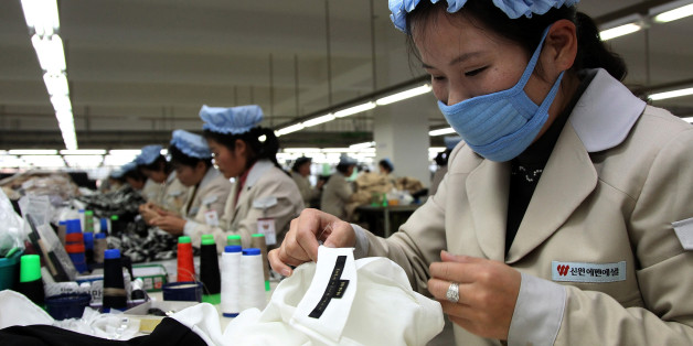 KAESONG, NORTH KOREA - DECEMBER 19: North Korean employees work at the assembly line of the factory of South Korean company at the Kaesong industrial complex on December 19, 2013 in Kaesong, North Korea. North Korea agreed on this rare cross-border trip of about 30 foreign officials and financial experts proposed by South Korea as the South Korean government watches on Pyongyang following the execution of leader Kim Jong-Un's uncle, Jang Song-Thaek. The Kaesong Industrial Complex was re-opened in September after a five-month closure caused by military tensions. (Photo by Park Jin-Hee-Pool/Getty Images)