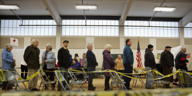Voters wait in line to cast ballots at a polling station inside Broken Gound Elementary School in Concord, New Hampshire, U.S., on Tuesday, Feb. 9, 2016. Voters in New Hampshire took to the polls today in the nation's first primary in the U.S. presidential race. Photographer: Victor J. Blue/Bloomberg via Getty Images