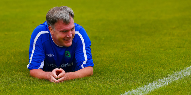Ed Balls on the pitch after stumbling during the MPs vs lobby journalists football match