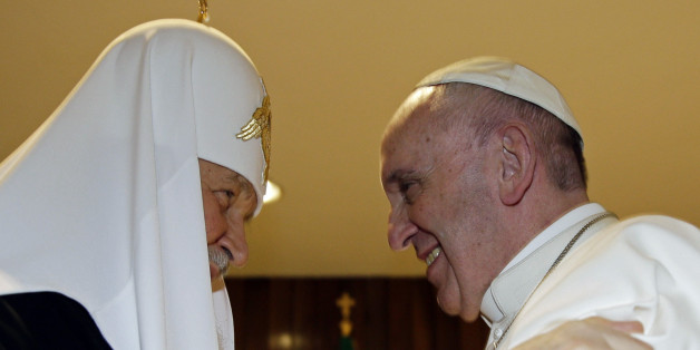 The head of the Russian Orthodox Church Patriarch Kirill, left, and Pope Francis meet at the Jose Marti airport in Havana, Cuba, Friday, Feb. 12, 2016. This is the first-ever papal meeting with the head of the Russian Orthodox Church, a historic development in the 1,000-year schism within Christianity. (Max Rossi/Pool photo via AP)
