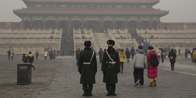 Chinese paramilitary policemen stand guard in the Forbidden City during a smoggy day in Beijing, China, Tuesday, Dec. 22, 2015. Beijing announced its second ever red alert for smog from Dec. 19 to 22, 2015. (AP Photo/Ng Han Guan)