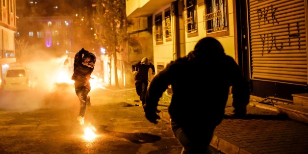A protestor prepares to throw molotov cocktail at Turkish police during a demonstration against government imposed curfews imposed on areas of eastern Turkey, on February 14, 2016 in Istanbul. / AFP / YASIN AKGUL (Photo credit should read YASIN AKGUL/AFP/Getty Images)
