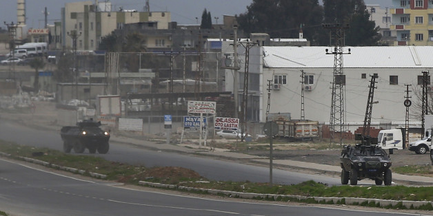 Turkish forces' armoured vehicles patrol at the southeastern town of Nusaybin, Turkey, near the border with Syria, where Turkish security forces are battling militants linked to the outlawed Kurdistan Workers, Party or PKK, Sunday, Feb. 14, 2016, a day after Turkish media reports said a police officer was injured in a clash. The private Dogan news agency said the militants on Saturday detonated an explosive device in the town as a military vehicle was passing by, but no one injured. A second bom