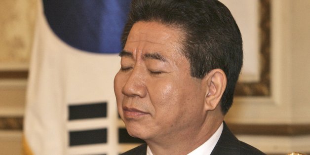 Outgoing South Korean president Roh Moo-hyun reacts during a farewell meeting with ministers at President House in Seoul, South Korea, Sunday, Feb. 24, 2008. The inauguration ceremony for new South Korean President Lee Myung-bak on Feb. 25. (AP Photo/ Yonhap, Park Chang-ki) **KOREA OUT**