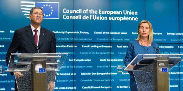 European Union High Representative Federica Mogherini, right, and Tunisia's Prime Minister Habib Essid address the media after a meeting at the EU Council building in Brussels on Monday, July 20, 2015. (AP Photo/Geert Vanden Wijngaert)