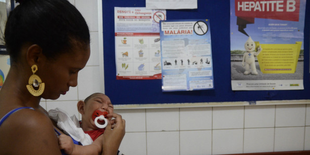 RECIFE, BRAZIL - FEBRUARY 01: João Heitor baby born with microcephaly is held by his mother Gabrielly Santana da Paz as they wait to see a doctor at Oswaldo Cruz Hospital on February 1, 2016 in Recife, Brazil. Health officials believe as many as 100,000 people have been exposed to the Zika virus in Recife, although most never develop symptoms. In the last four months, authorities have recorded around 4,000 cases in Brazil in which the mosquito-borne Zika virus may have led to microcephaly