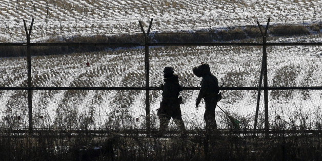 South Korean soldiers patrol near the border village of the Panmunjom (DMZ) that separates the two Koreas since the Korean War, in Paju, north of Seoul, South Korea, Monday, Dec. 26, 2011. North Korea's state media on Monday called Kim Jong Il's heir the head of the ruling Workers' Party Central Committee, a job that gives Kim Jong Un power over one of the country's highest decision-making bodies more than a week after his father's death. (AP Photo/ Lee Jin-man)