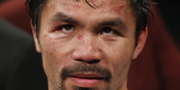Manny Pacquiao, from the Philippines, waits after the welterweight title fight against Floyd Mayweather Jr., on Saturday, May 2, 2015 in Las Vegas. (AP Photo/John Locher)