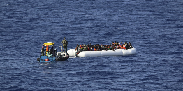 In this photo provided by the Swedish Coast Guard, a tug boat from the ship Poseidon reaches a rubber boat with 130 migrants off the Libyan coast Wednesday, Aug. 26, 2015. The Swedish ship Poseidon immediately after rescued 439 survivors aboard a wooden ship, discovering in the hull the corpses of 51 migrants who died, probably of asphyxiation, making the dangerous Mediterranean crossing in hopes of reaching Europe. (Swedish Coast Guard via AP Photo) MANDATORY CREDIT