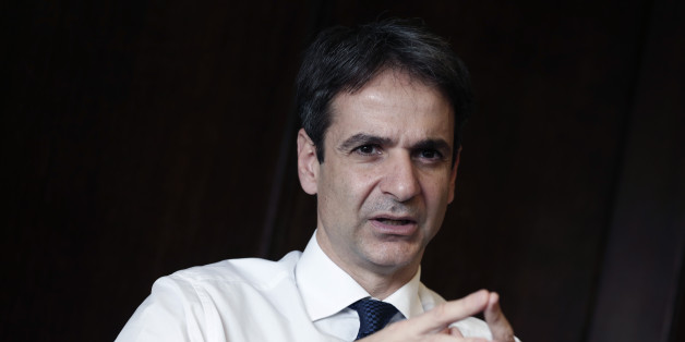 Greek Administrative Reform Minister Kyriakos Mitsotakis speaks during an interview with the Associated Press in Athens, Tuesday, April 8, 2014. Mitsotakis said years of austerity have left Greece with about 200,000 fewer civil servants than before its debt crisis erupted in late 2009. He added that the country has made significant overall progress, which should allow it to tap international capital markets "in the foreseeable future." (AP Photo/Petros Giannakouris)