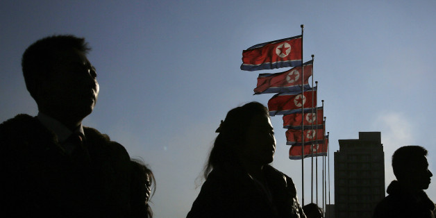 North Korean men and women are silhouetted with their country's national flags in the background during a mass dance party as part of celebrations of the "Day of the Shining Star" or birthday anniversary of late North Korean leader Kim Jong Il on Tuesday, Feb. 16, 2016, in Pyongyang, North Korea. The celebrations of the Kim's birthday anniversary, a revered national holiday, came as South Koreaâs president warned that North Korea faces collapse if it doesnât abandon its nuclear weapons