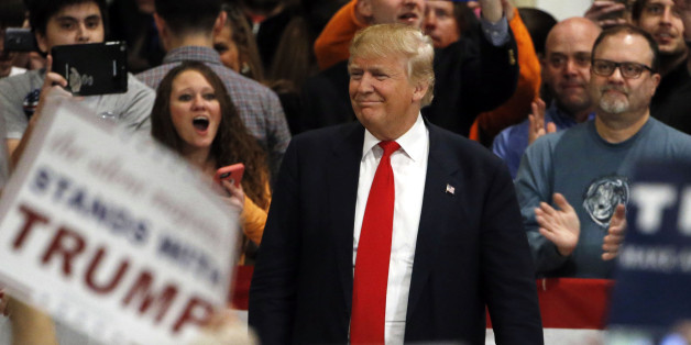 Republican presidential candidate Donald Trump makes his way to the stage during a campaign stop Friday, Feb. 19, 2016, in North Charleston, S.C. (AP Photo/Matt Rourke)