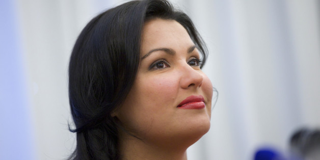 Russian leading operatic soprano Anna Netrebko speaks at a news conference in Moscow on Tuesday, June 18, 2013. Netrebko and Russian leading baritone opera singer Dmitry Khvorostovsky will take part in a concert at Moscow's Red Square on Wednesday. (AP Photo/Ivan Sekretarev)