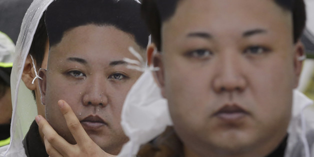 North Korean defectors wearing masks of North Korean leader Kim Jong Un attend a rally against North Korea's rocket launch and nuclear test in Seoul, South Korea, Friday, Feb. 12, 2016. South Korea has cut off power and water supplies to a factory park in North Korea, officials said Friday, a day after the North deported all South Korean workers there and ordered a military takeover of the complex that had been the last major symbol of cooperation between the rivals. (AP Photo/Ahn Young-joon)