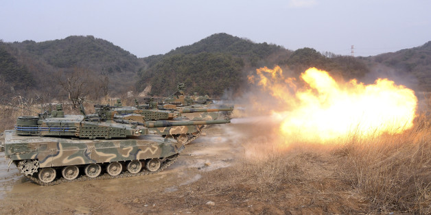 South Korean army K-2 tanks fires during a live firing drill at a fire training field in Yangpyeong, South Korea, Thursday, Feb. 18, 2016. North Korean leader Kim Jong Un recently ordered preparations for launching "terror" attacks on South Koreans, a top Seoul official said Thursday, as worries about the North grow after its recent nuclear test and rocket launch. (Jang Se-young/Newsis via AP) KOREA OUT