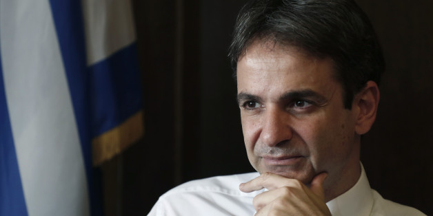 Greek Administrative Reform Minister Kyriakos Mitsotakis listens during an interview with the Associated Press in Athens, Tuesday, April 8, 2014. Mitsotakis said years of austerity have left Greece with about 200,000 fewer civil servants than before its debt crisis erupted in late 2009. He added that the country has made significant overall progress, which should allow it to tap international capital markets "in the foreseeable future." (AP Photo/ Petros Giannakouris)