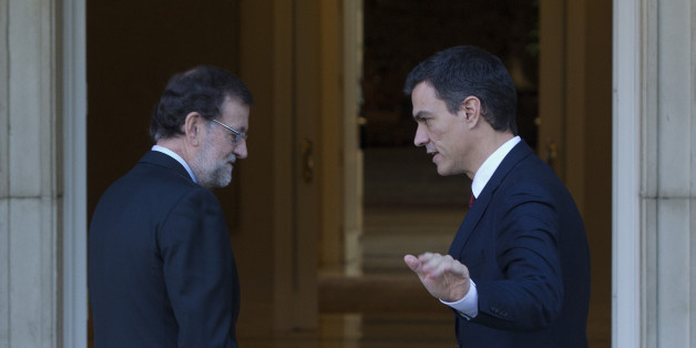 Spain's acting Prime Minister Mariano Rajoy, left and main Socialist opposition leader Pedro Sanchez enter the Moncloa Palace for a meeting in Madrid, Spain, Wednesday, Dec. 23, 2015. Spanish Prime Minister Mariano Rajoy will meet with Sanchez to launch complicated talks on forming a coalition or minority government after his party won the most votes in national elections but fell short of a parliamentary majority. If there is still deadlock after two months, King Felipe VI calls a new election. (AP Photo/Paul White)