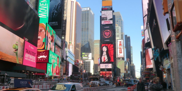 Times Square is a major commercial intersection in Midtown Manhattan, at the junction of Broadway and 7th Avenue, and stretching from West 42nd to West 47th Streets. Brightly adorned with billboards and advertisements, Times Square is one of the world's most visited tourist attractions, drawing an estimated fifty million visitors annually. Approximately 330,000 people pass through Times Square daily, many of them tourists.