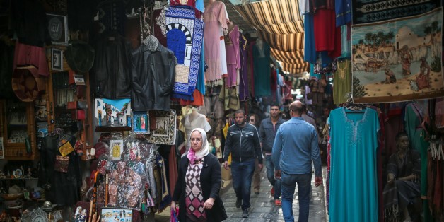 People walk through the Medina market in Tunis, Tunisia, Monday, Oct. 26, 2015. (AP Photo/Mosa'ab Elshamy)