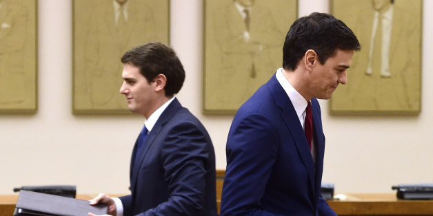 Leader of Spanish Socialist Party (PSOE) Pedro Sanchez (R) and leader of center-right party Ciudadanos, Albert Rivera hold documents to sign an agreement to support the socialist leader as candidate to lead the new Spanish government, in Madrid on February, 24, 2016
Spain's Socialists, racing to end weeks of political deadlock following inconclusive elections, announced today that the centrist Ciudadanos party has agreed to back their candidate for prime minister during the upcoming March, 2 investiture session.
/ AFP / Pierre-Philippe MARCOU (Photo credit should read PIERRE-PHILIPPE MARCOU/AFP/Getty Images)